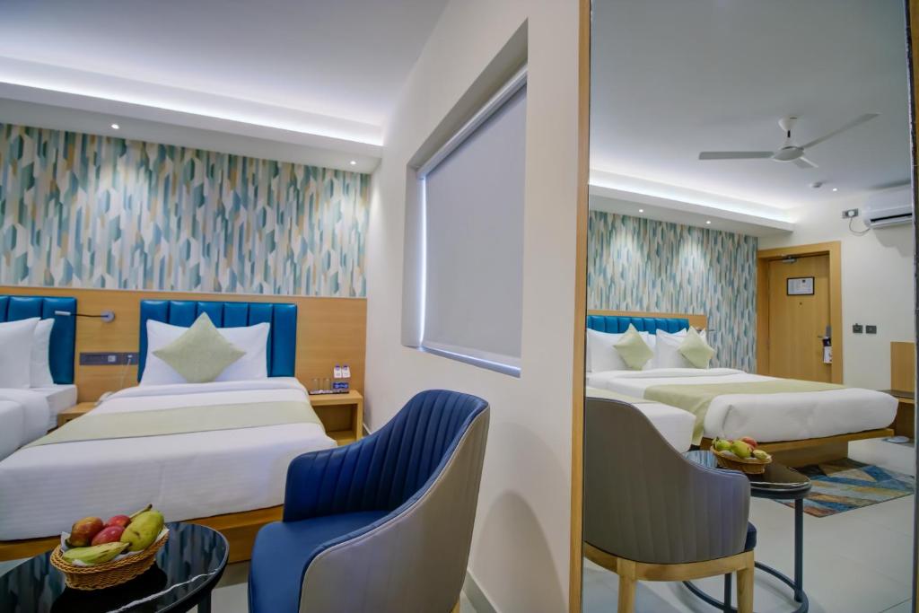 Postel nebo postele na pokoji v ubytování Cozzet Victoria Hotel