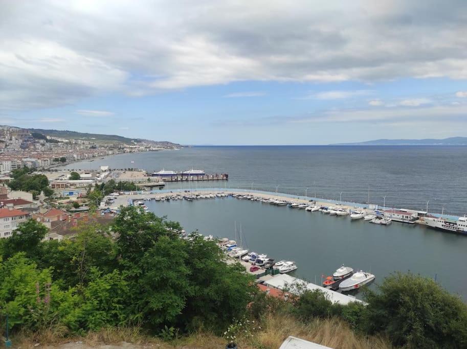 a harbor with a bunch of boats in the water at Clifftop Bliss: Beach View, 2BR in Mudanya