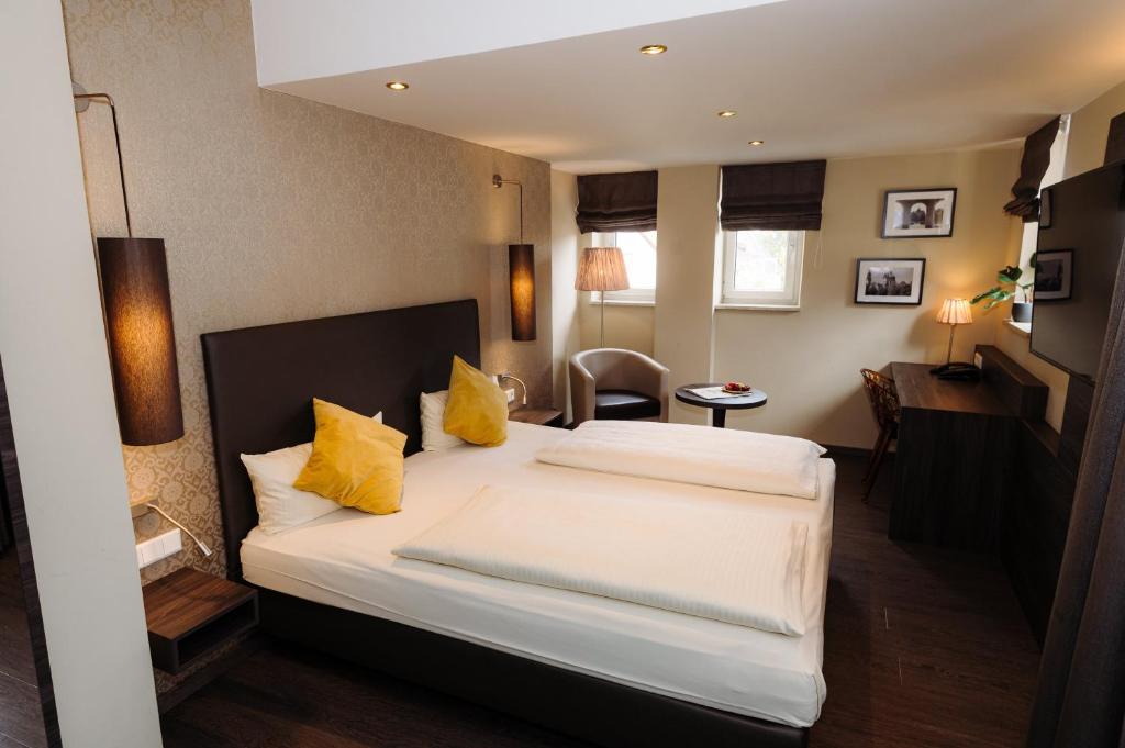Postel nebo postele na pokoji v ubytování Hotel Säntis