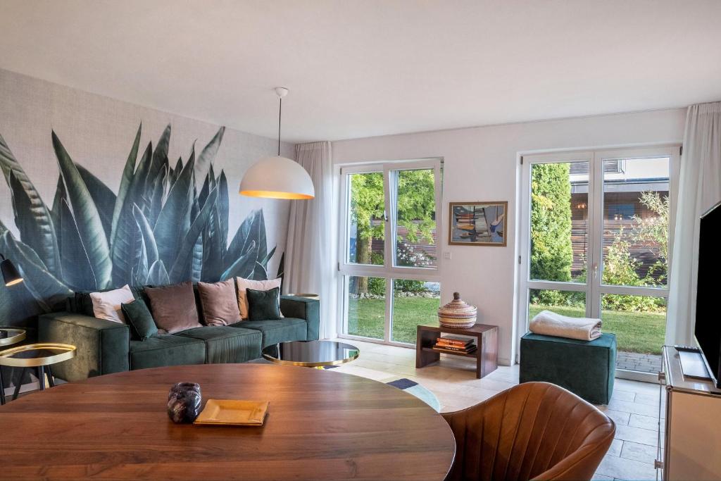 a living room with a couch and a table at Ferienwohnung Tödiblick in Wangen im Allgäu