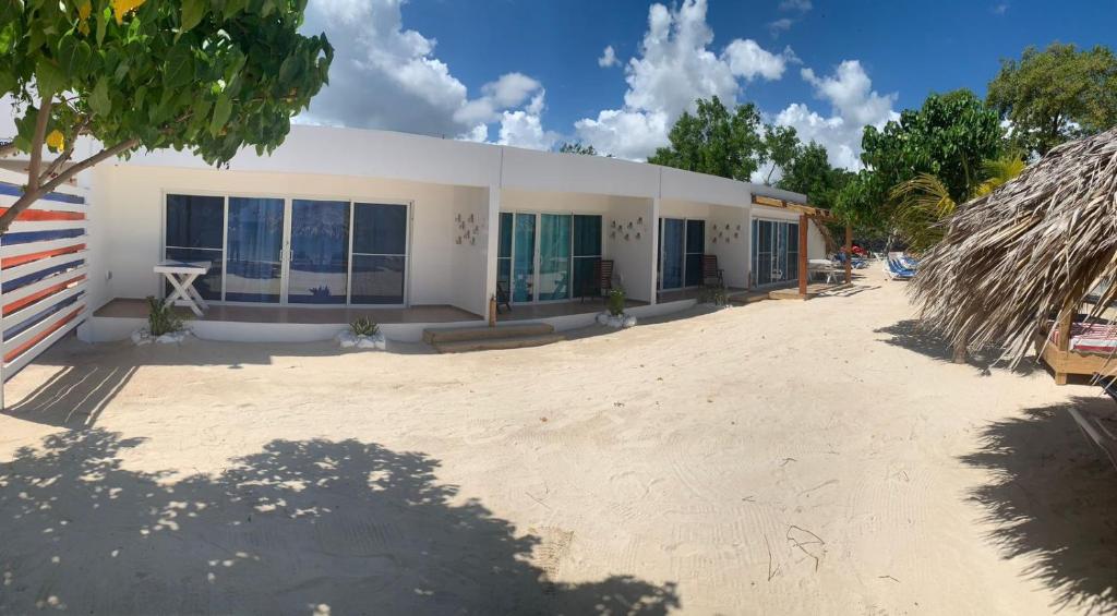 a building with a lot of windows on a beach at La Isla Bonita in Punta Rucia