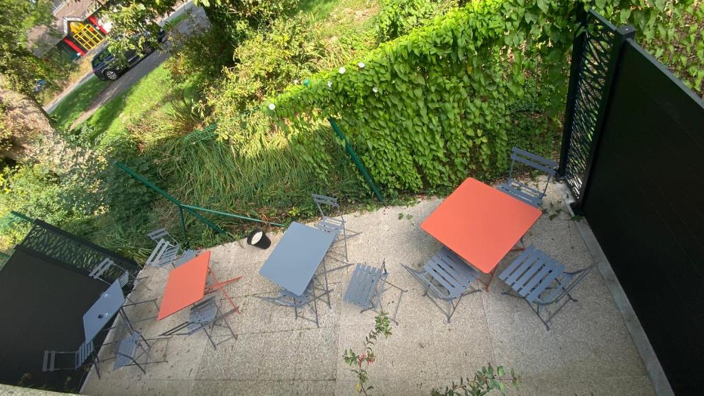 an overhead view of tables and chairs on a patio at Premiere Classe Quimper in Quimper
