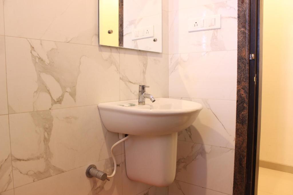 Koupelna v ubytování Hotel Sai Ramanand