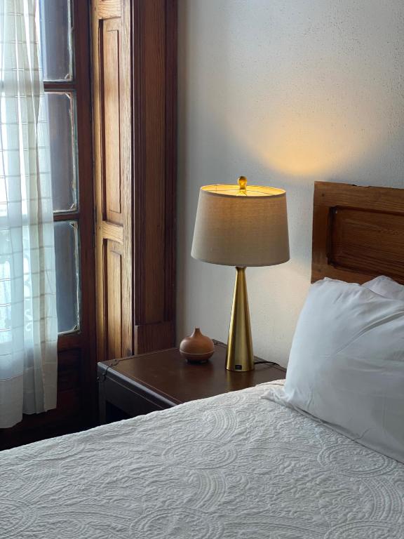 Postel nebo postele na pokoji v ubytování Casa Aspeytia Hotel Boutique
