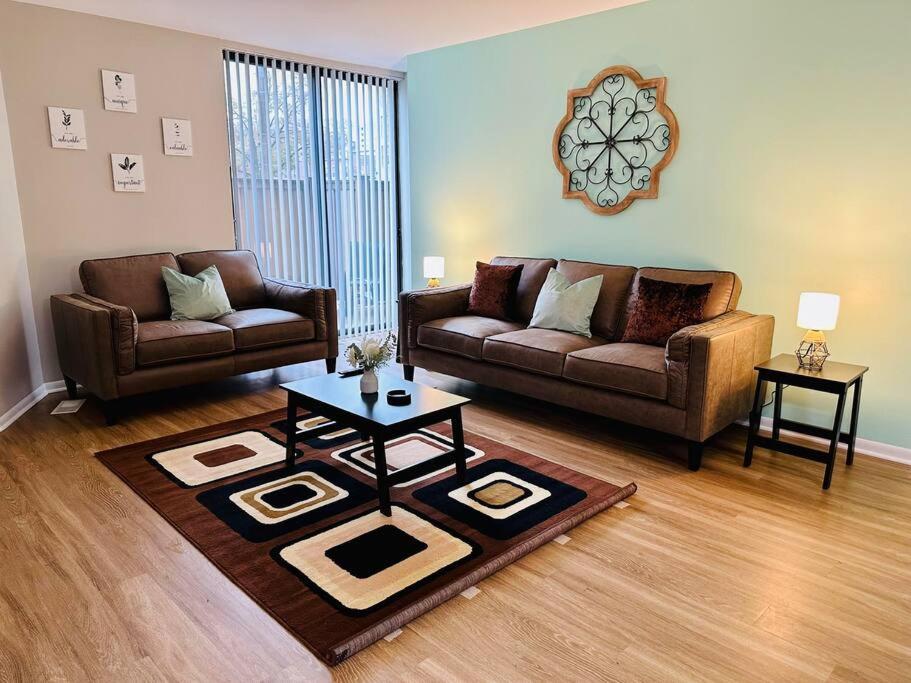 A seating area at Charming Retreat in Oak Park, IL Modern Comforts