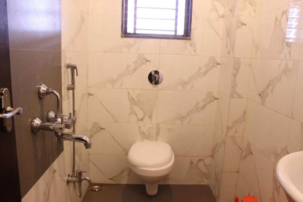 Koupelna v ubytování Hotel Sai Ramanand