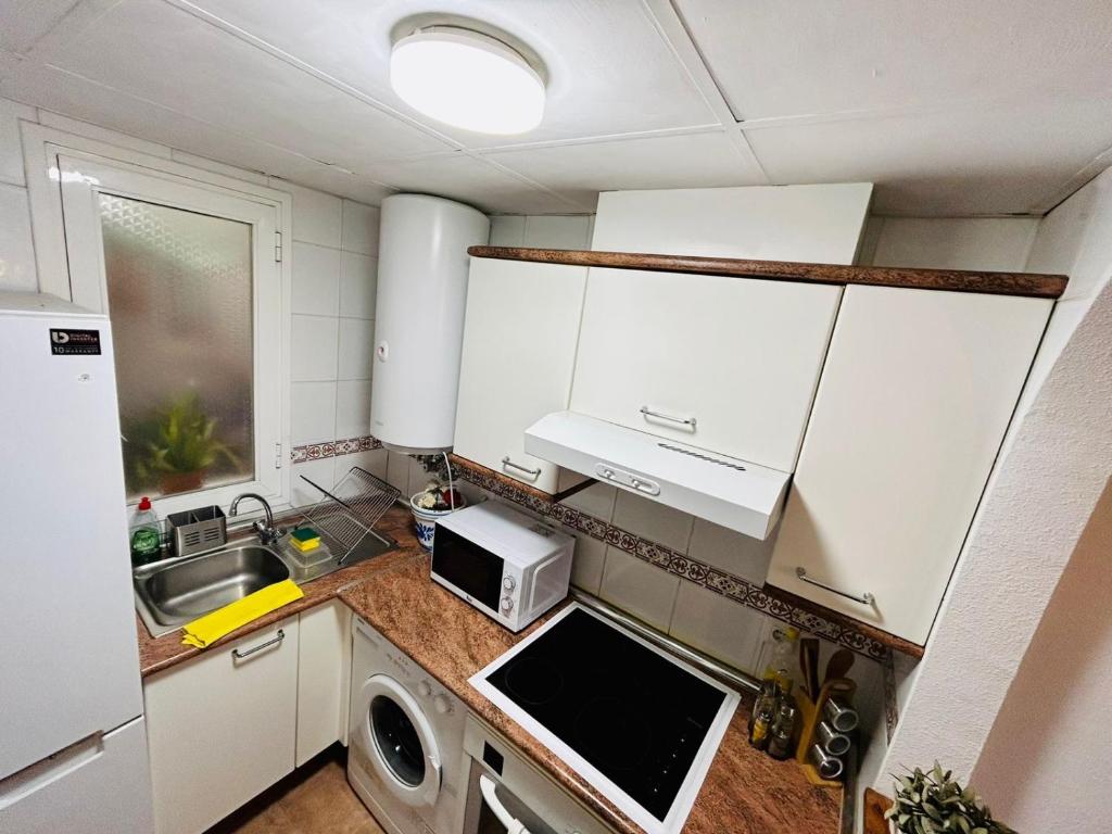 Kuchyň nebo kuchyňský kout v ubytování Marina Apartment Beach