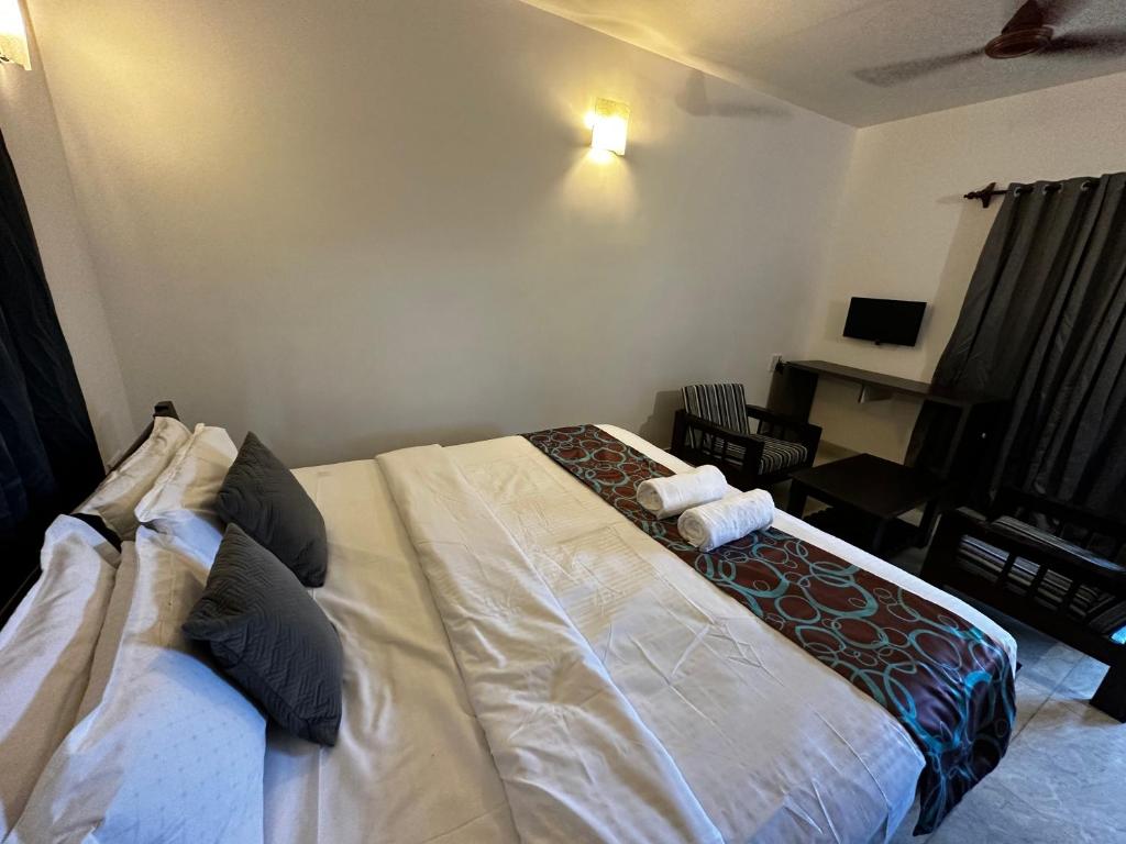 Postel nebo postele na pokoji v ubytování Sunshine Vagator
