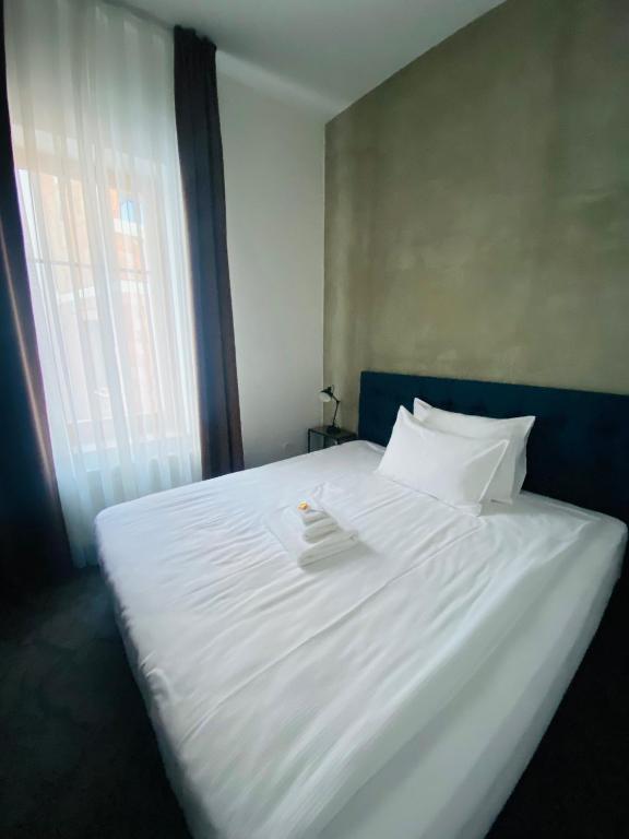 Postel nebo postele na pokoji v ubytování Riverside Hotel Plzeň