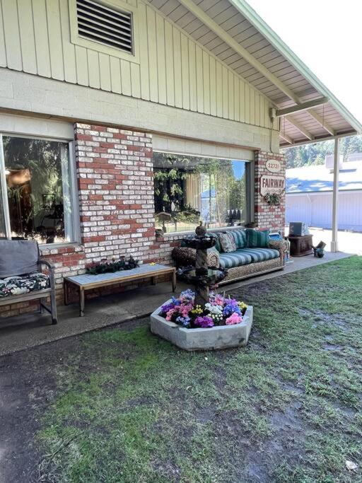 a patio with a fountain in the middle of a yard at Fairway Apartments Unit 1 in Twain Harte