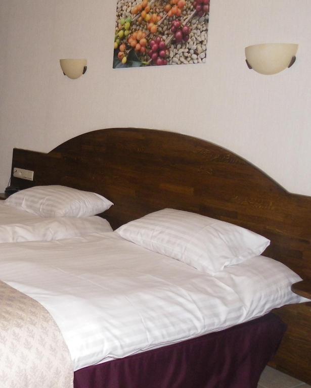 Postel nebo postele na pokoji v ubytování Hotel Van Reeth's Koffiebranderij