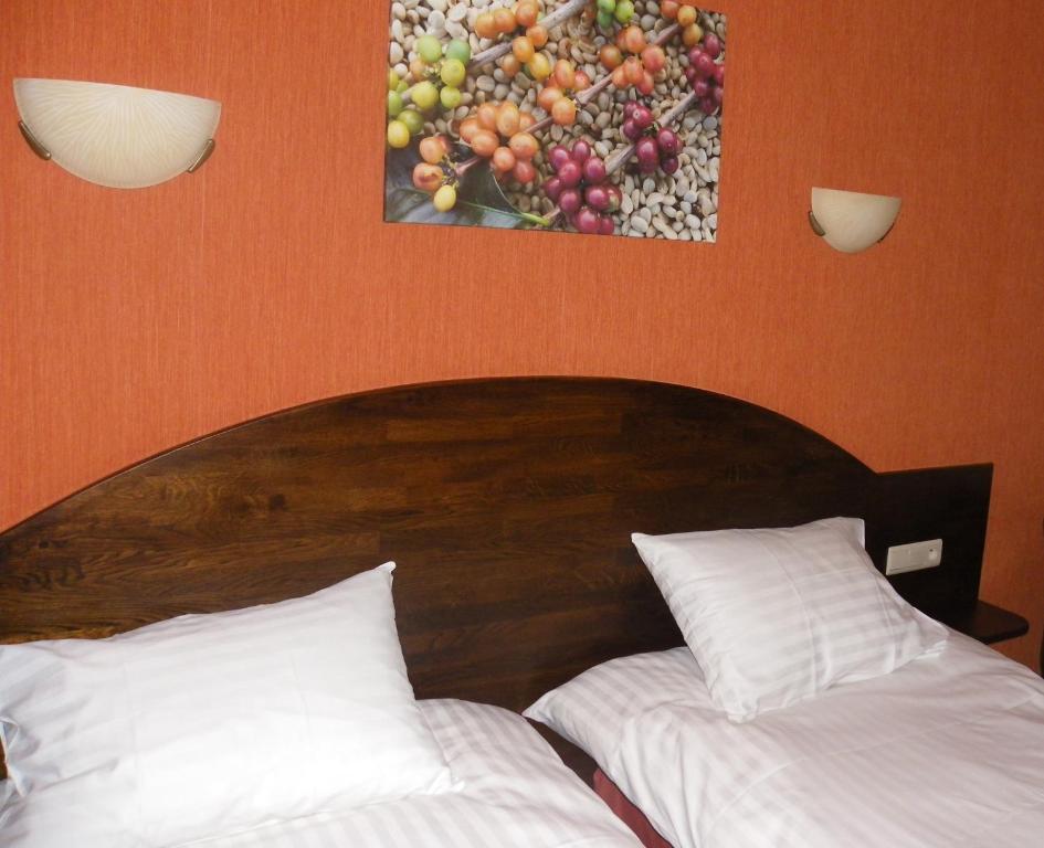 Postel nebo postele na pokoji v ubytování Hotel Van Reeth's Koffiebranderij