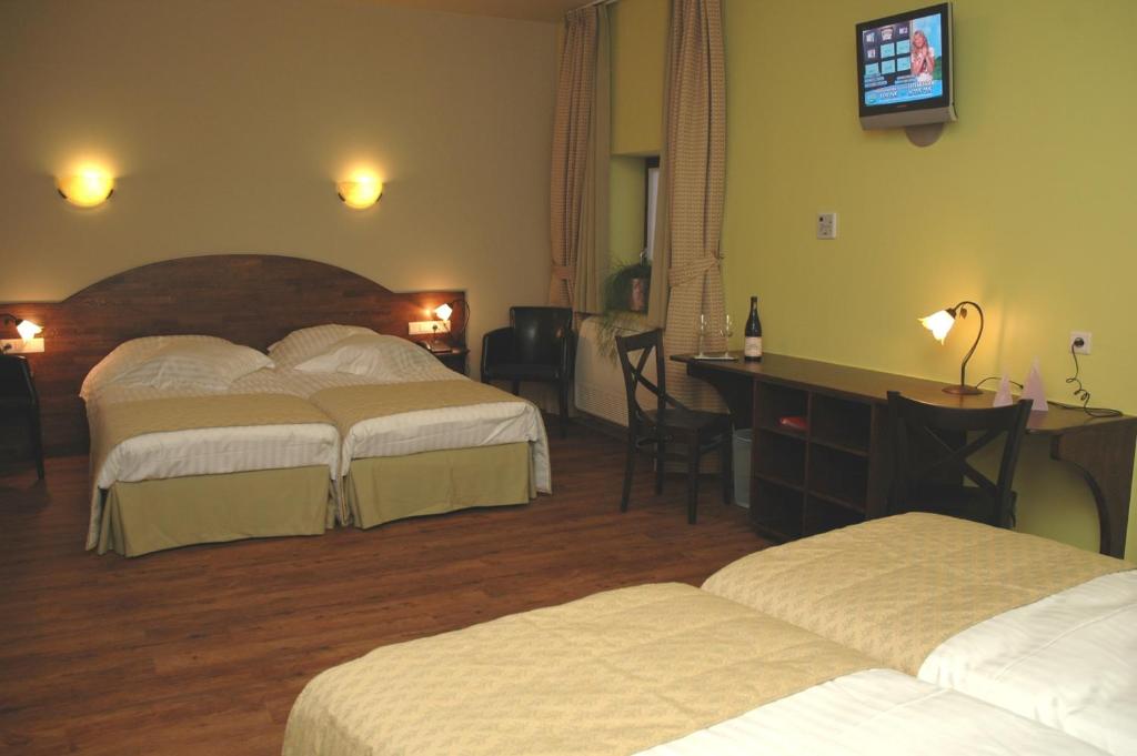 Postel nebo postele na pokoji v ubytování Hotel Van Reeth's Koffiebranderij