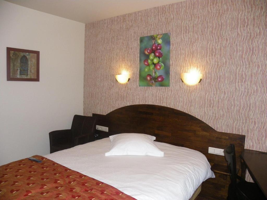 Postel nebo postele na pokoji v ubytování Hotel Van Reeth's Koffiebranderij