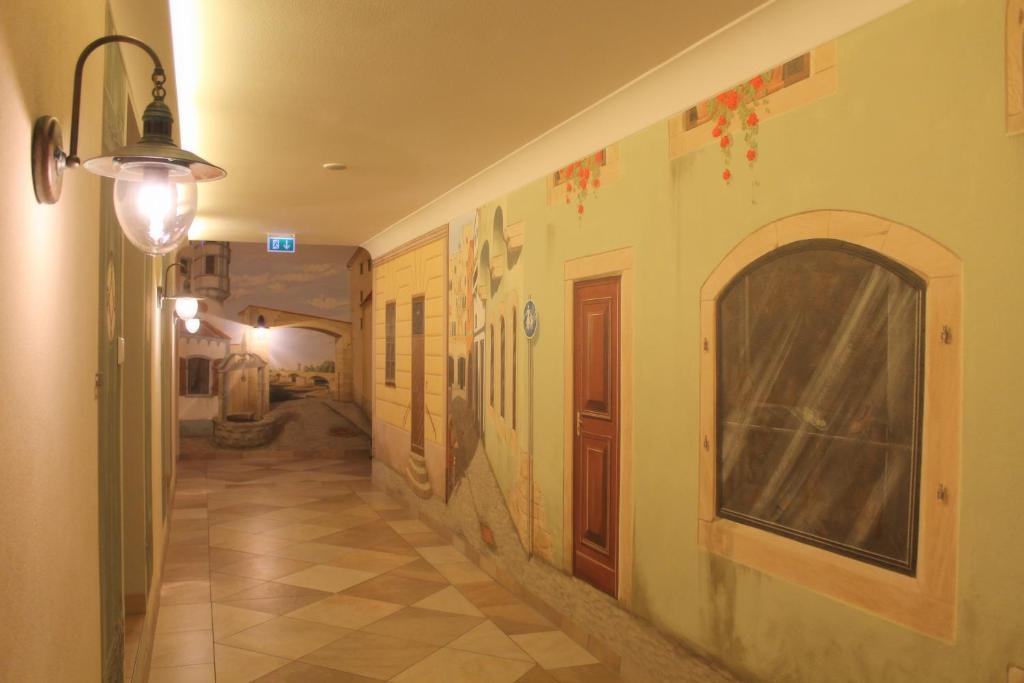 a hallway of a house with a hallwayngth at Garden & SPA Hotel Das Götzfried in Regensburg