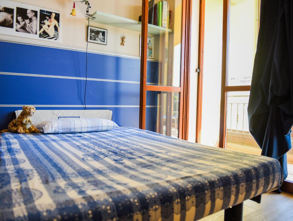 Postel nebo postele na pokoji v ubytování A Casa di Lidia 15 min dal Lago di Garda e Verona Centro Vicinissima Terme Acquardens
