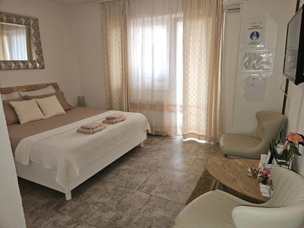 Postel nebo postele na pokoji v ubytování Rooms Sapina
