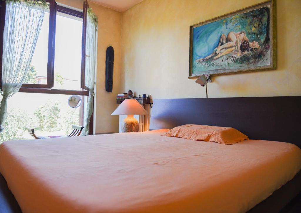 Postel nebo postele na pokoji v ubytování A Casa di Lidia 15 min dal Lago di Garda e Verona Centro Vicinissima Terme Acquardens
