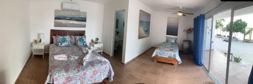 Postel nebo postele na pokoji v ubytování La Isla Bonita