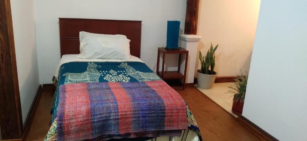 Postel nebo postele na pokoji v ubytování Aylluwasi Guesthouse