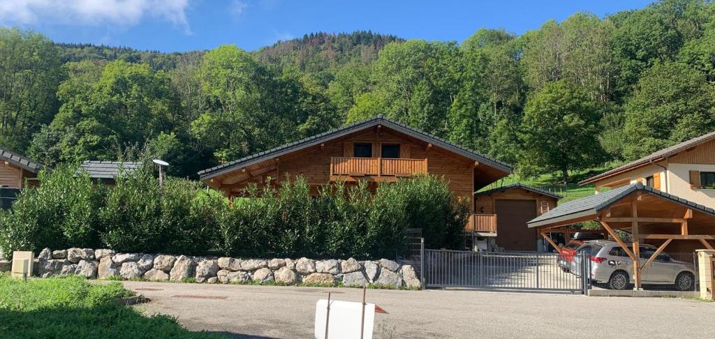 a house with a car parked in front of it at Chalet Maillet Mieussy in Mieussy