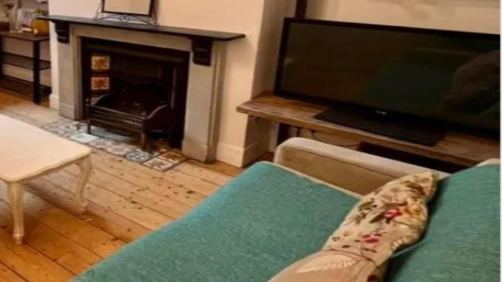 a living room with a couch and a tv and a fireplace at Chalet Platte Solden in Sölden