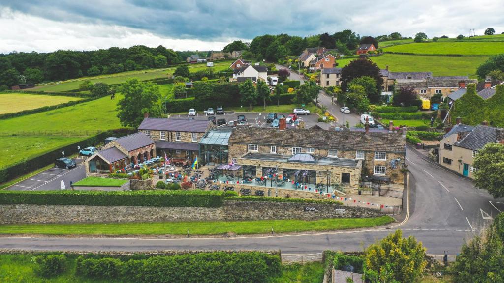 an aerial view of a building in a village at The Peacock at Barlow in Chesterfield