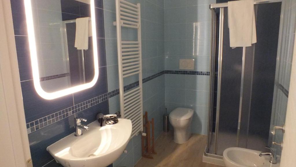 a bathroom with a sink and a shower and a toilet at My Bnb Pisa in Pisa
