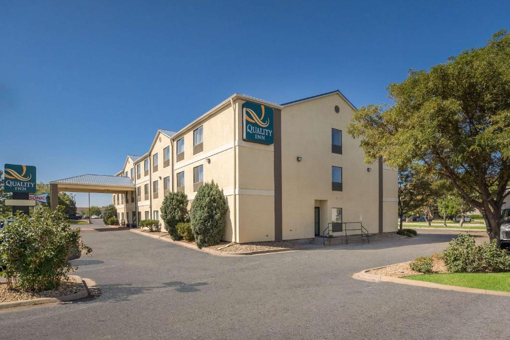 a hotel with a sign on the front of it at Quality Inn Denver Northeast Brighton in Brighton