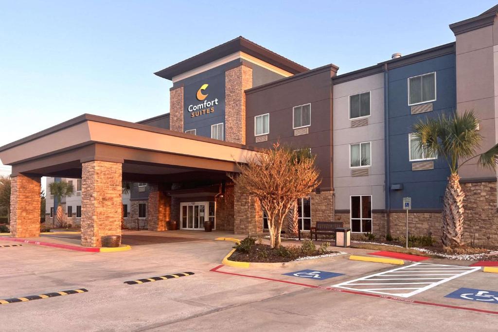 a hotel with a parking lot in front of it at Comfort Suites Seabrook - Kemah in Seabrook
