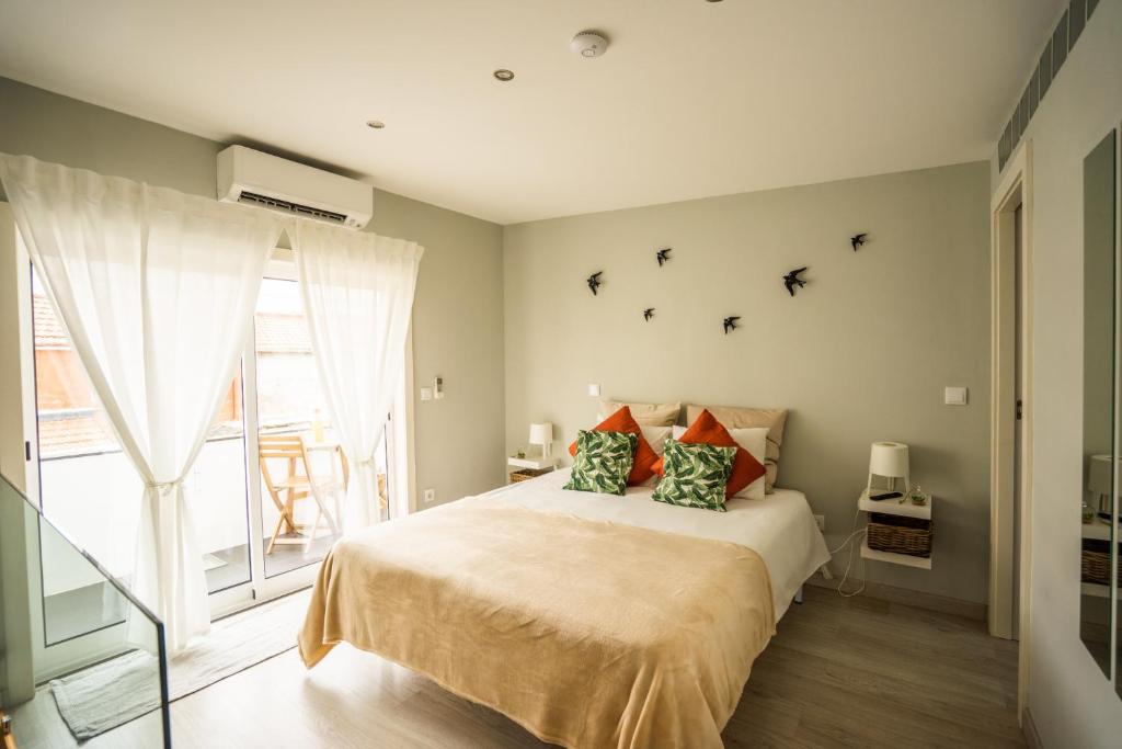 En eller flere senge i et værelse på Oporto Explorers