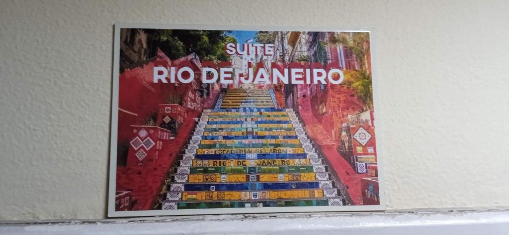 a poster of a staircase with the words rico beamerore at Lapa Bed and breakfast Apartamento Rio de Janeiro in Rio de Janeiro