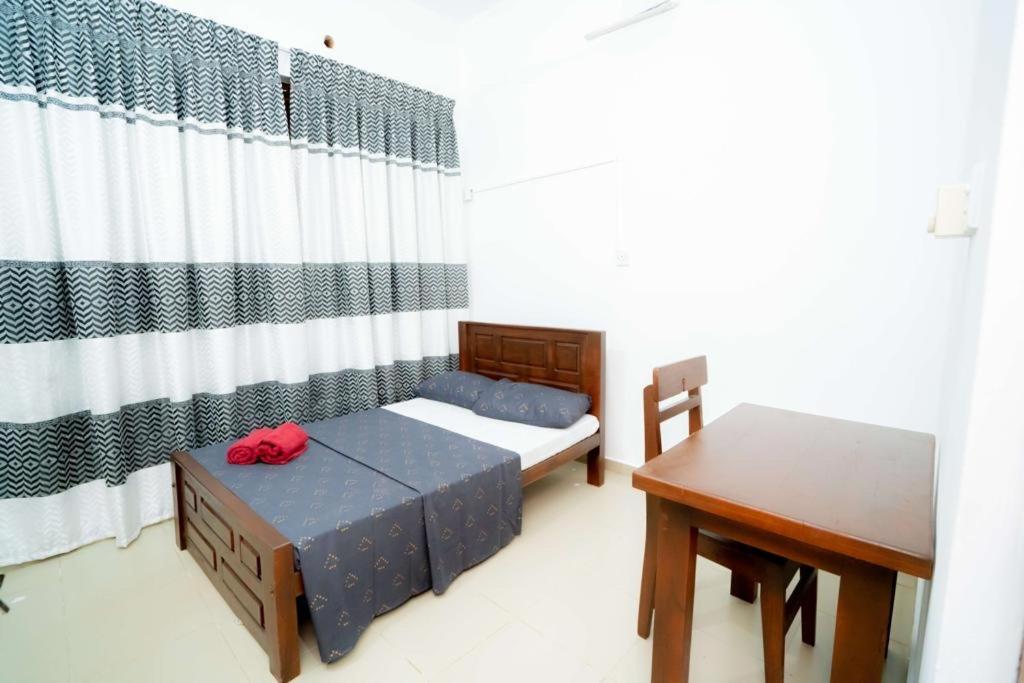 Postel nebo postele na pokoji v ubytování East Gate 8-9 Batticaloa