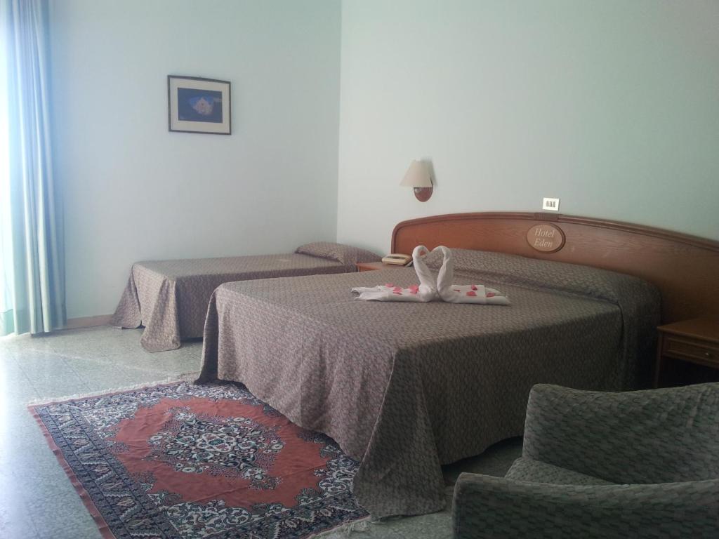 Postel nebo postele na pokoji v ubytování Hotel Eden