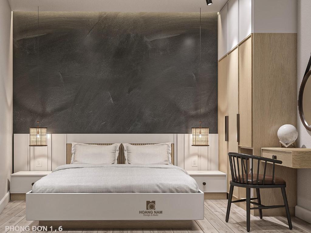 Un pat sau paturi într-o cameră la Happy Hotel Bình Tân