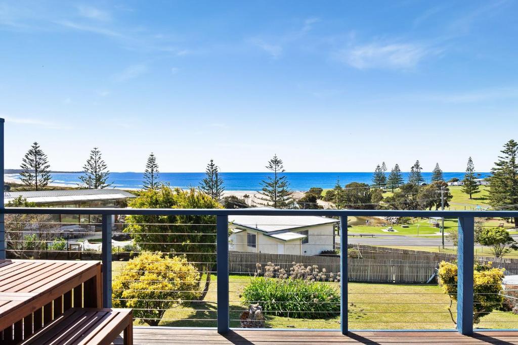 a view of the ocean from the balcony of a house at 22 Dulling Street Beach House in Dalmeny