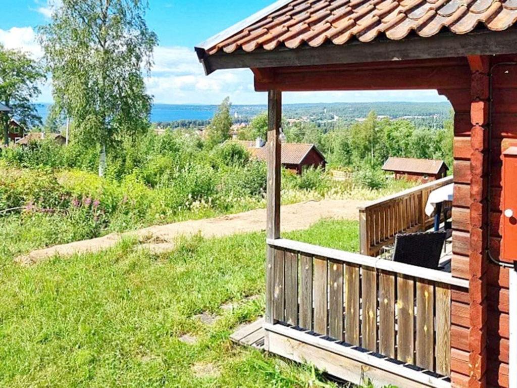 a gazebo on the side of a house at Holiday home RÄTTVIK in Rättvik