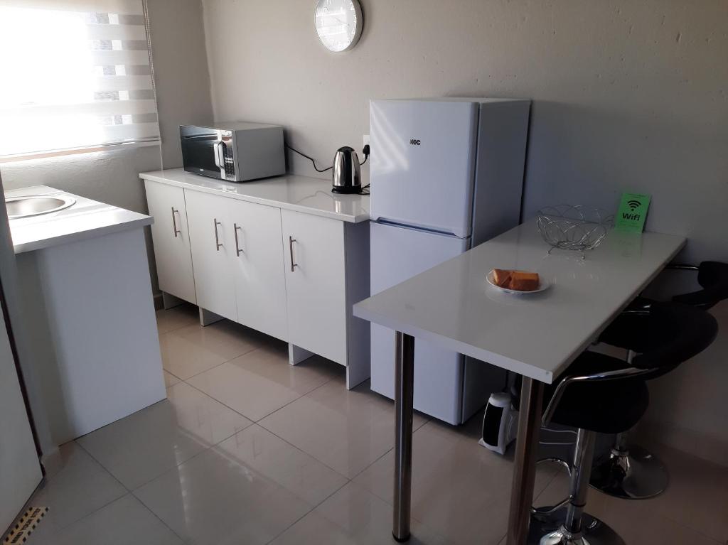Kuchyň nebo kuchyňský kout v ubytování Bonfai Residence