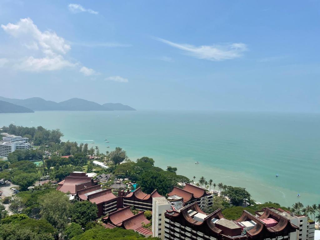 an aerial view of a city and the ocean at The Ferringhi Sea View at Sri Sayang in Batu Ferringhi