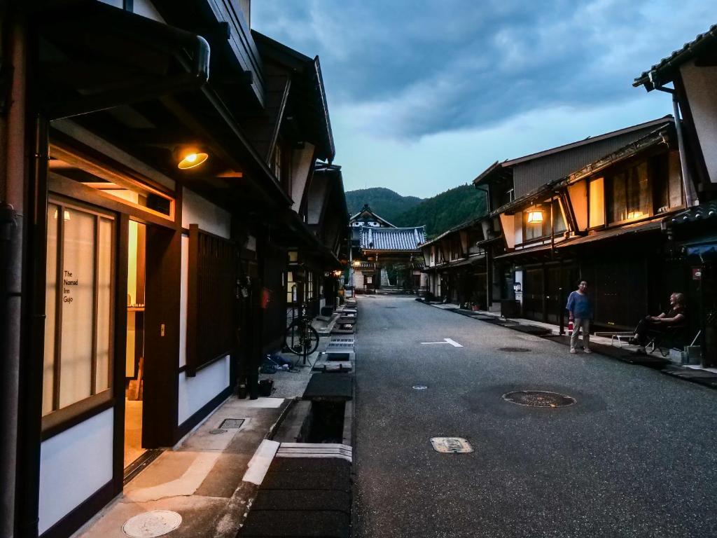 an empty street in an old town with buildings at The　Nomad　Inn　Gujo in Gujo