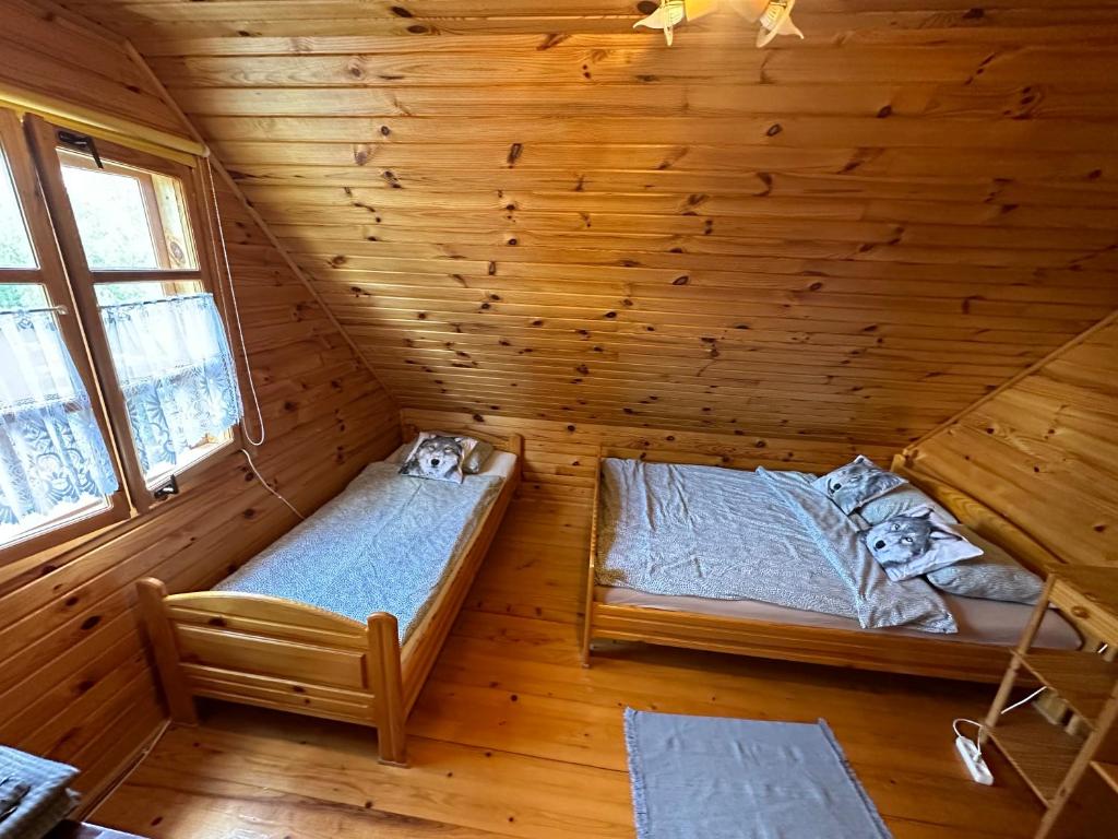 Krevet ili kreveti u jedinici u okviru objekta Urocza chata z sauną w bieszczadzkim Parku Krajobrazowym