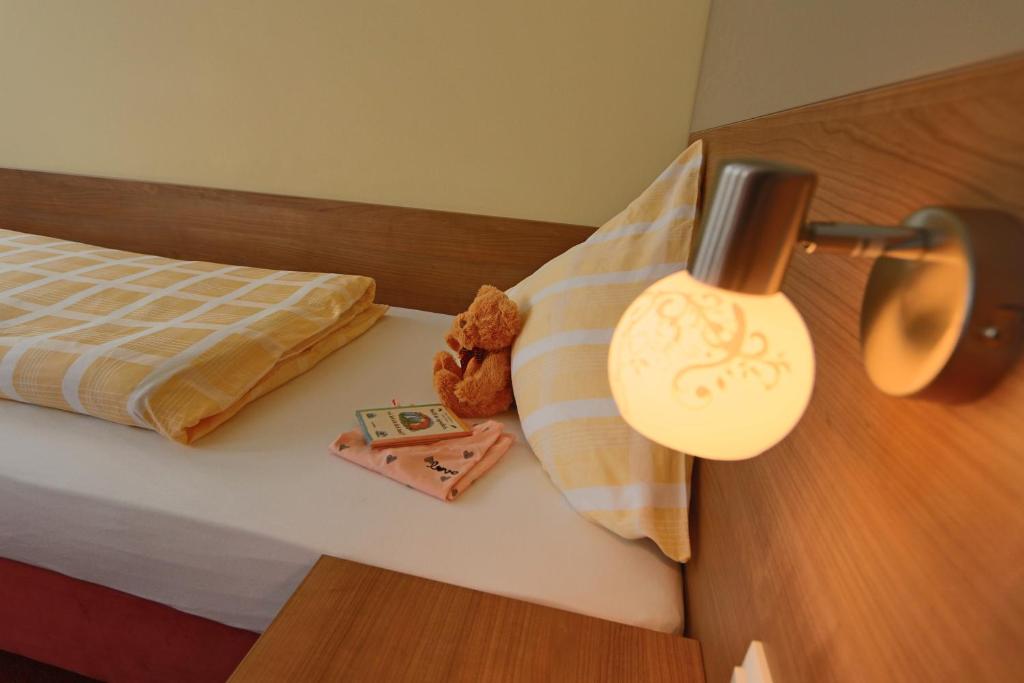 Postel nebo postele na pokoji v ubytování Gasthof Krancher