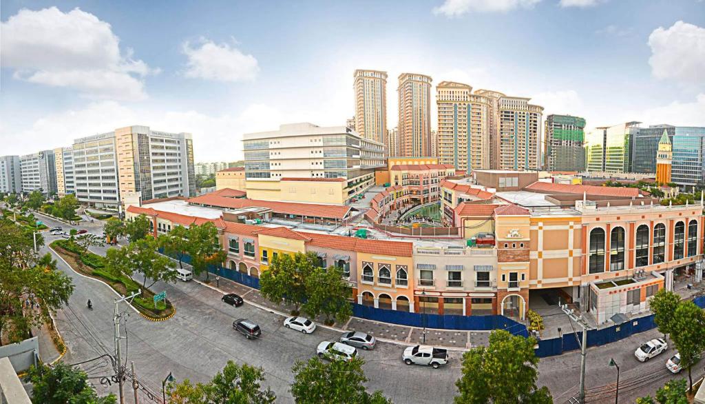 a rendering of a city with tall buildings at Viceroy McKinley Hill BGC in Manila