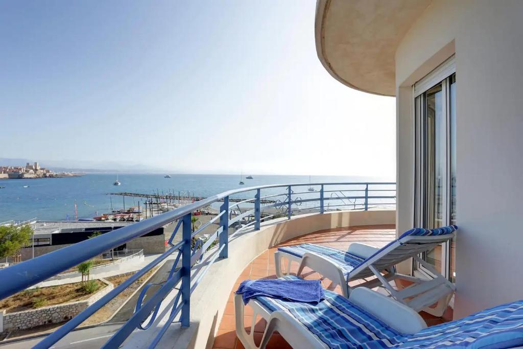 a balcony with chairs and a view of the ocean at Luxury Apartment with amazing SEA view at Cap d'Antibes in Antibes