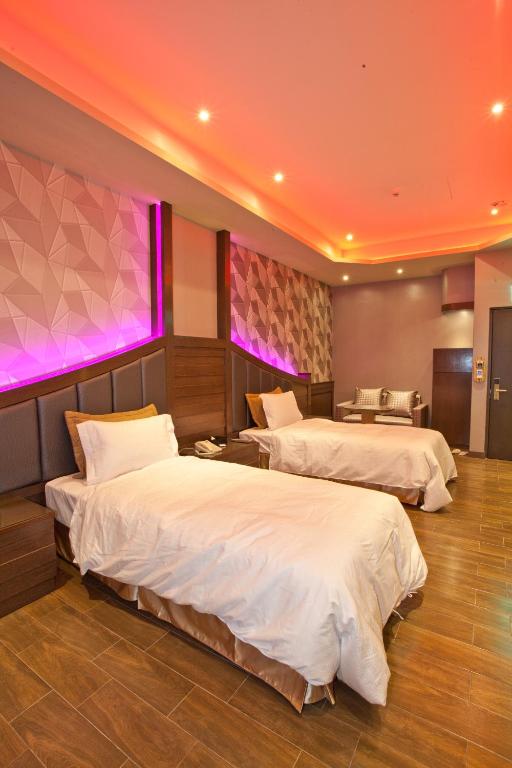 Postel nebo postele na pokoji v ubytování Wei Feng Hotel - Kaohsiung