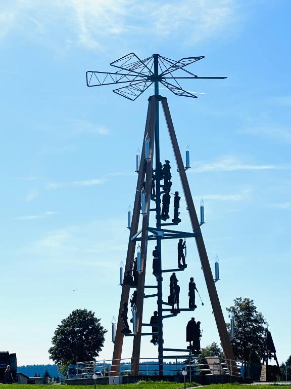 a group of people standing on top of a windmill at Ferienwohnung Johanngeorgenstadt in Johanngeorgenstadt