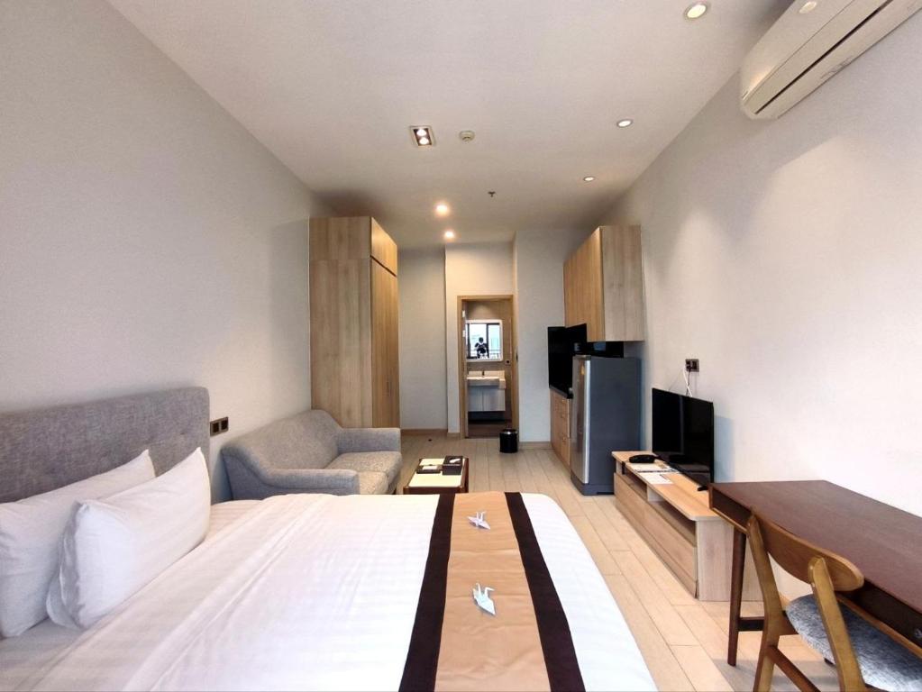 Postel nebo postele na pokoji v ubytování The View Serviced Residence 豪景日式酒店公寓