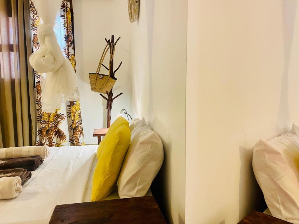Postel nebo postele na pokoji v ubytování Casa Hera Diani