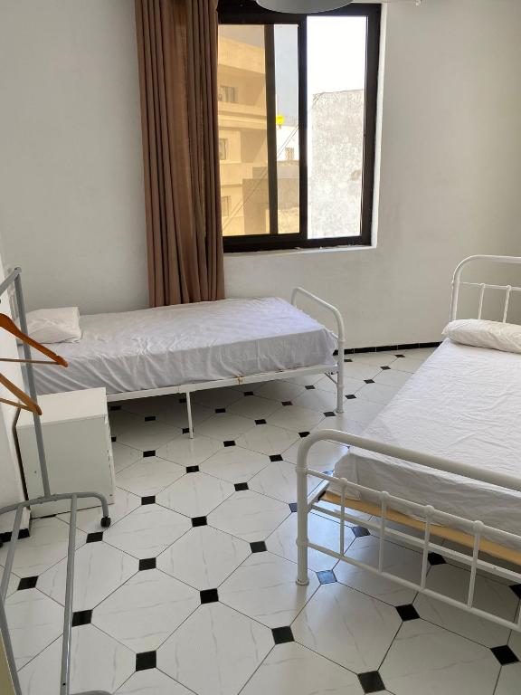 Postel nebo postele na pokoji v ubytování Tangier City center, room with 2 single beds