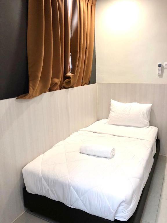 Postel nebo postele na pokoji v ubytování Garden Inns Motel